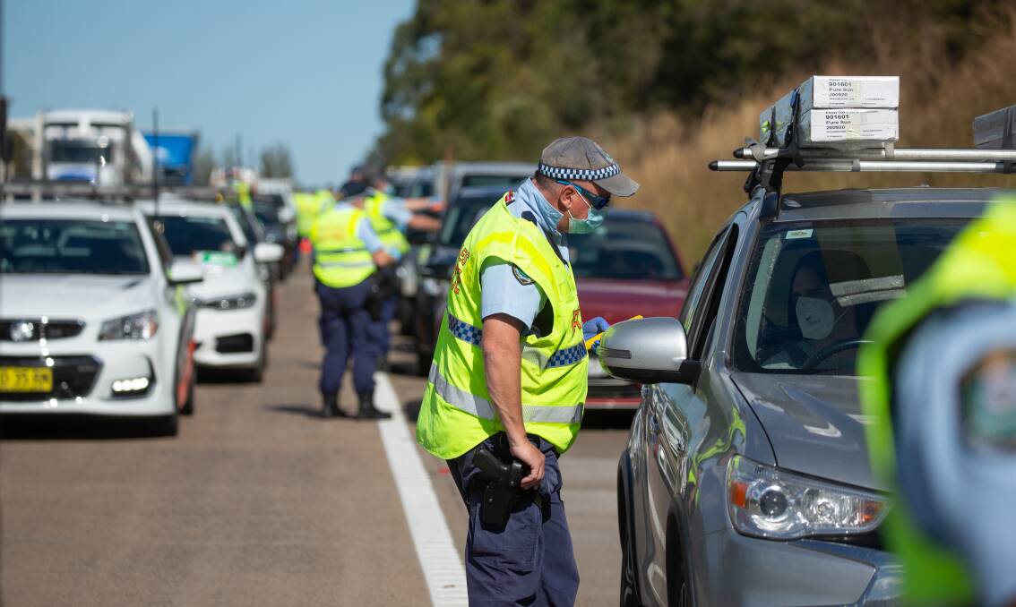 CHECKPOINT: Police stopping northbound cars on the M1 motorway. Picture: Marina Neil
