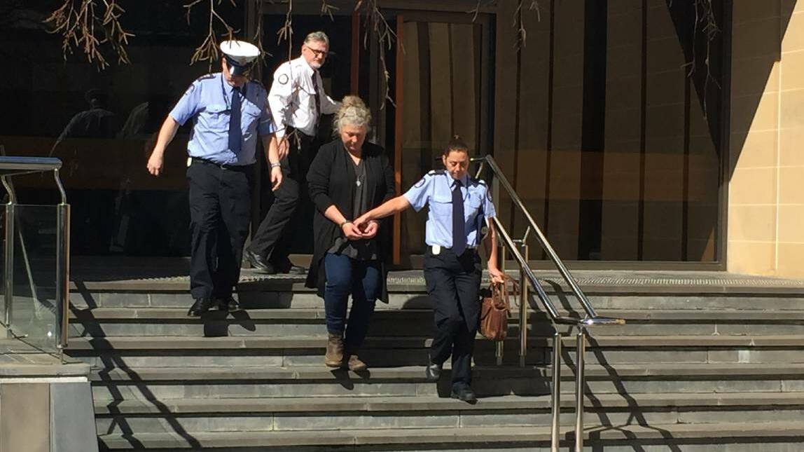 GONE: Letetia Anne Ware is escorted from the Hobart Supreme Court. Picture: Emily Jarvie