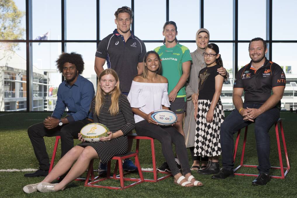 PART OF IT: Lakeisha Hull (sitting, centre) with Michael Hooper, Charlotte Caslick and other 'faces of the game'. Photo: AUSTRALIAN RUGBY UNION