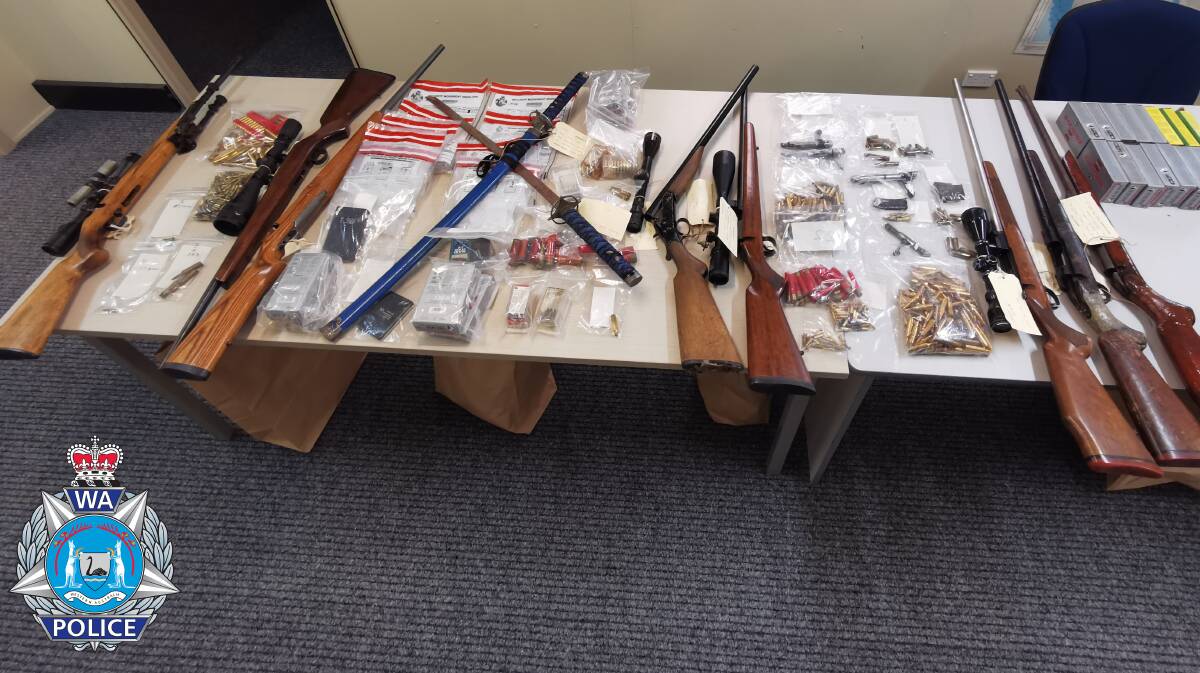 A police spokesman said a haul of firearms, ammunition and drug paraphernalia was recovered after officers executed a search warrant at the neighbour's house. Photo: Supplied 