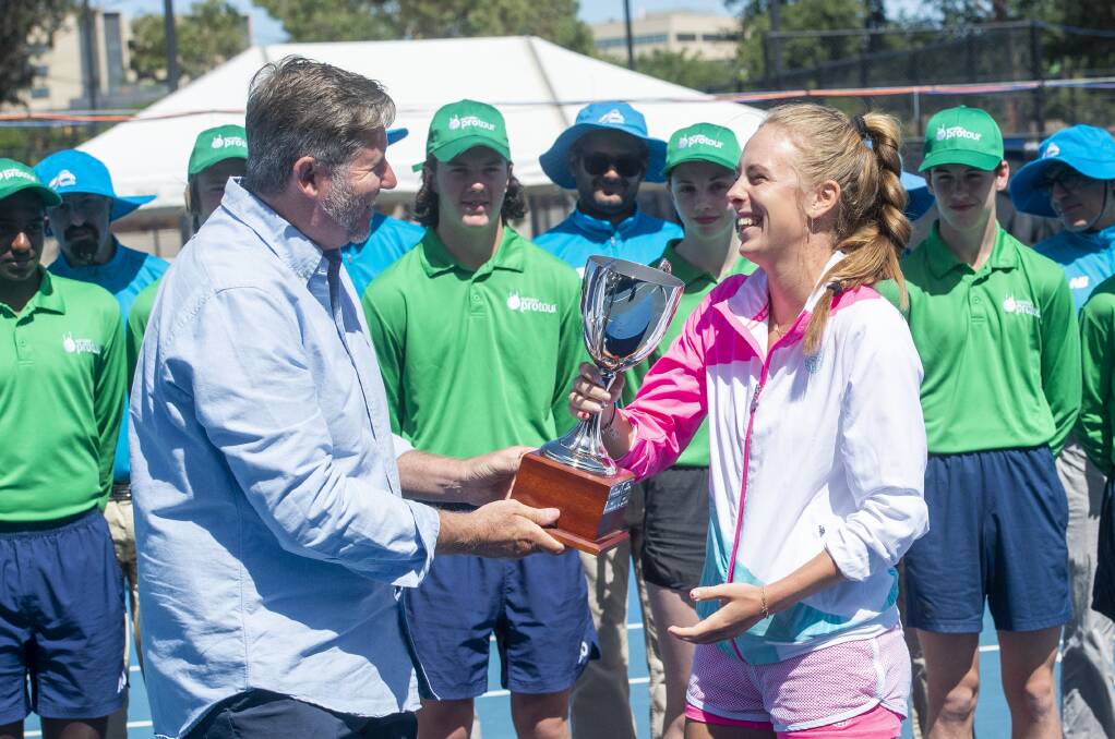 Poland's Magdalena Frech accepts her trophy at the Bendigo Tennis Centre in Nolan Street. Picture: DARREN HOWE