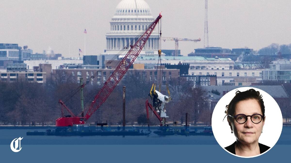 Parts of a passenger plane being scooped out of the Potomac River in Washington DC. Picture Getty Images Parts of a passenger plane being scooped out of the Potomac River in Washington DC. Picture Getty Images