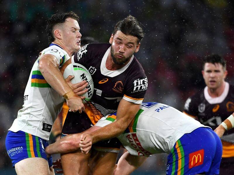 Brisbane lock and stand-in captain Patrick Carrigan (with ball) helps dismantle Canberra 34-10. (Jono Searle/AAP PHOTOS)