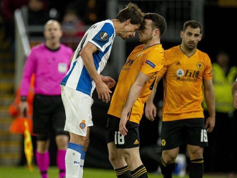 Ander Iturraspe (l) reacts with Wolves' Diogo Jota but he was not intimidated, scoring a hat-trick.