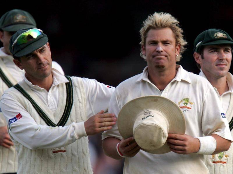Shane Warne takes his hat after his final over against old enemy England in the 2005 Ashes.