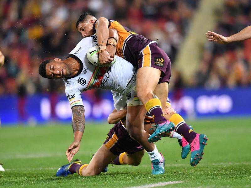 Panthers' Viliame Kikau (l) takes a hit in the NRL defeat to Brisbane Broncos at Suncorp Stadium.