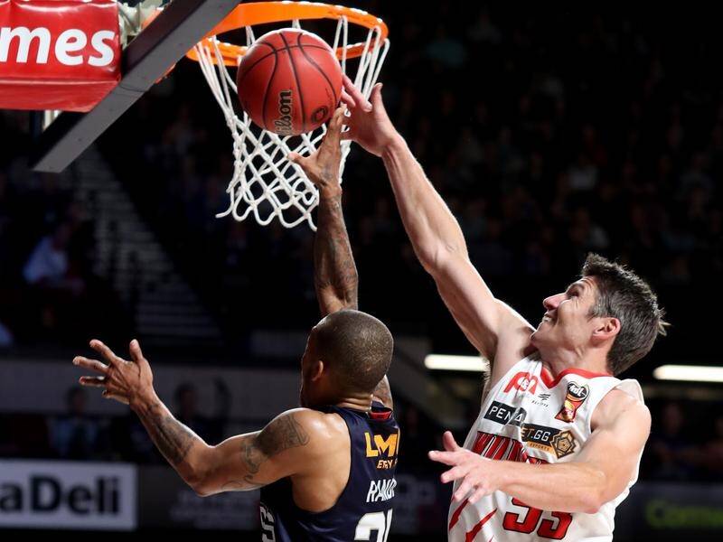 Defender Damian Martin (right) was the match-winner for Perth in their 99-95 NBL win over Adelaide.