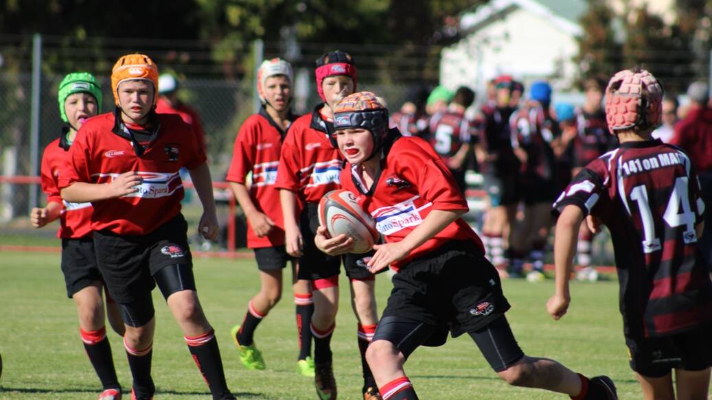 Under 13s' Reg McPherson on the charge. Photos: Contributed.