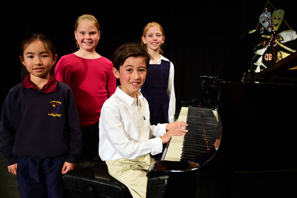 SHINING ON STAGE: The young piano players gave it their all at the Dubbo eisteddfod on Tuesday in the nine years and under solo section, impressing the adjudicator. Photo: BELINDA SOOLE