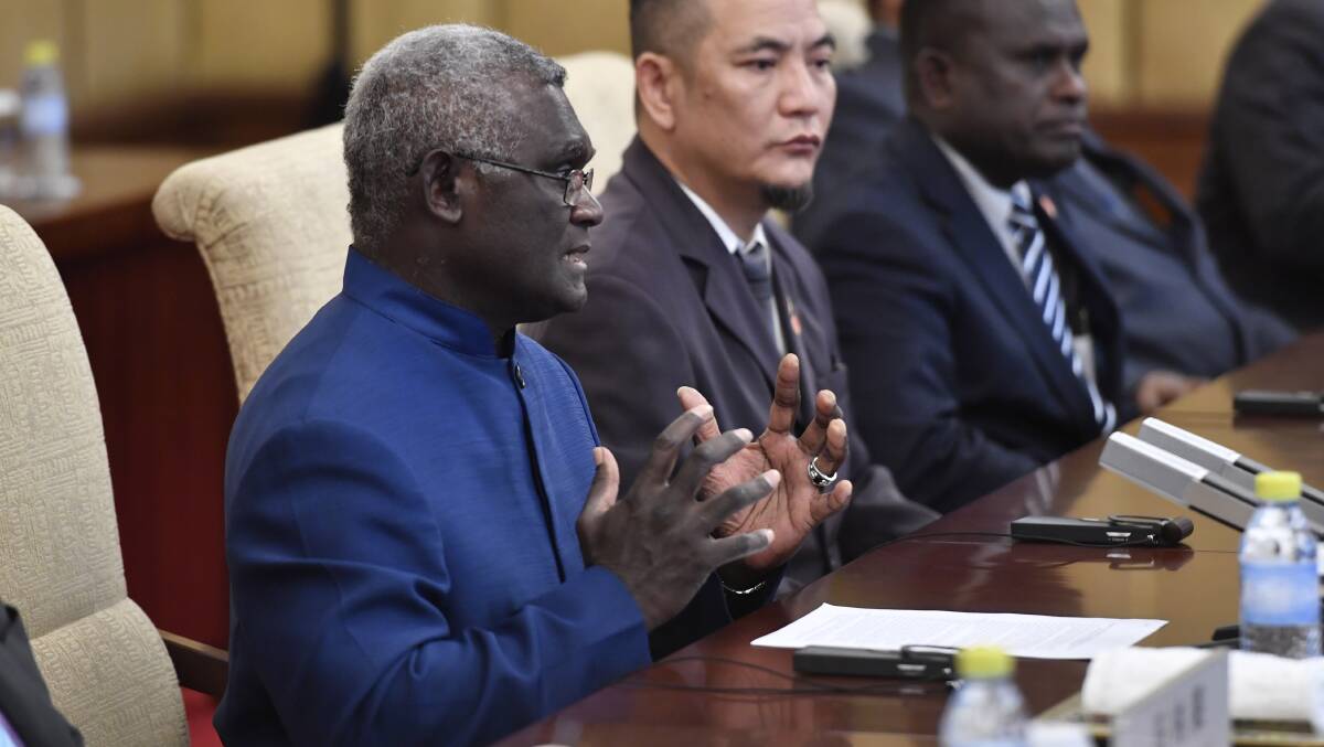 Solomon Islands Prime Minister Manasseh Sogavare meets with Chinese officials in Beijing in 2019. Picture: Getty Images
