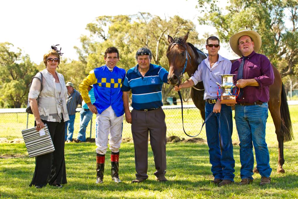 One Last Shot after winning the Peggy Fulwood Memorial Geurie Cup Cup last year. Pictured at the presentation is owner Sue McKinnon, jockey Ricky Blewitt, trainer and part-owner John McKinnon, strapper Justin Stanley and Terry Fulwood, son of the late Peggy Fulwood. Photo: JANIAN MCMILLAN (www.racing.photography.com.au).